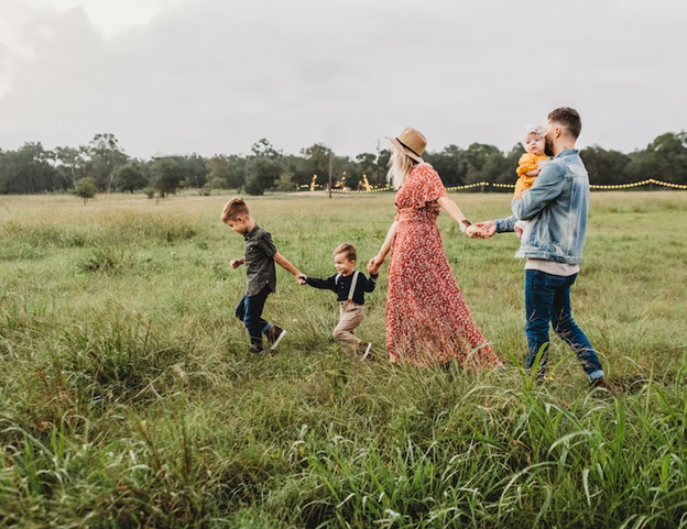Unsplash photo of family walking in field